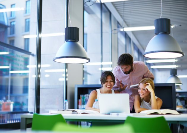 Employees chatting in office space