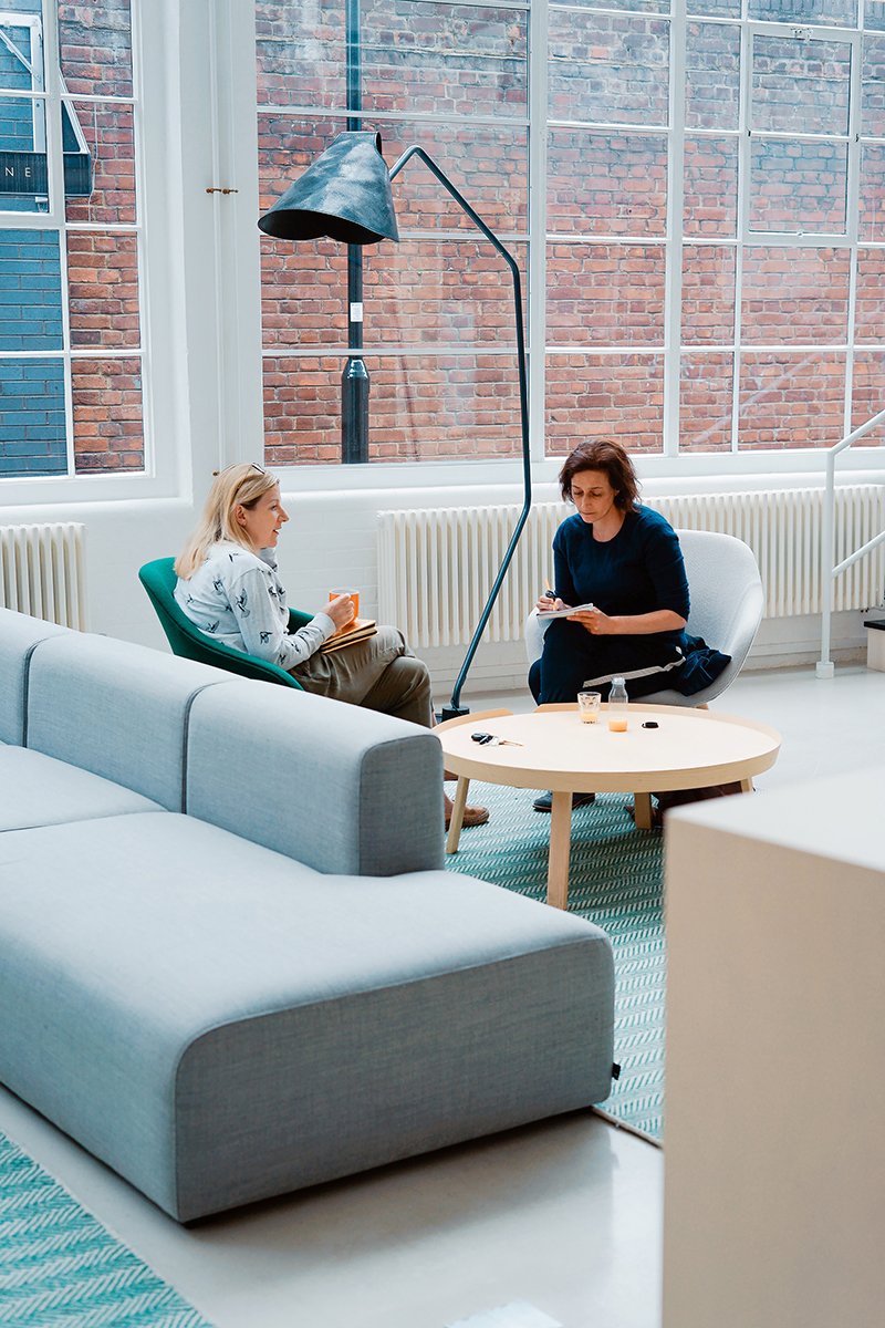 Two business Women having a meeting and taking notes