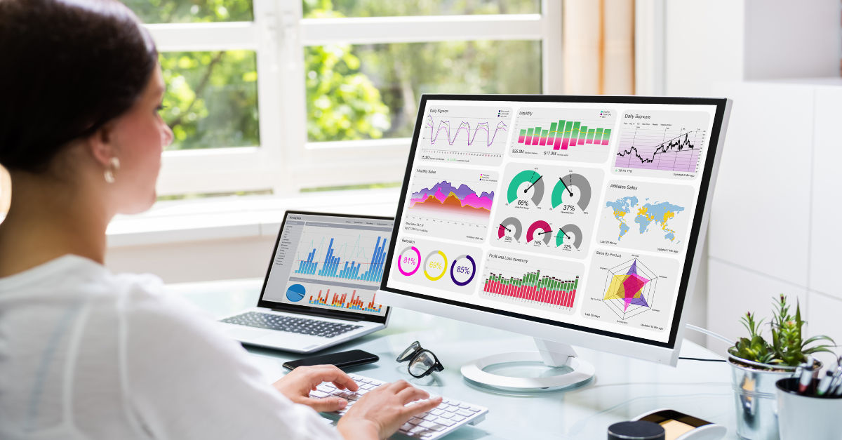 Lady sat in front of computer showing CRM dashboard